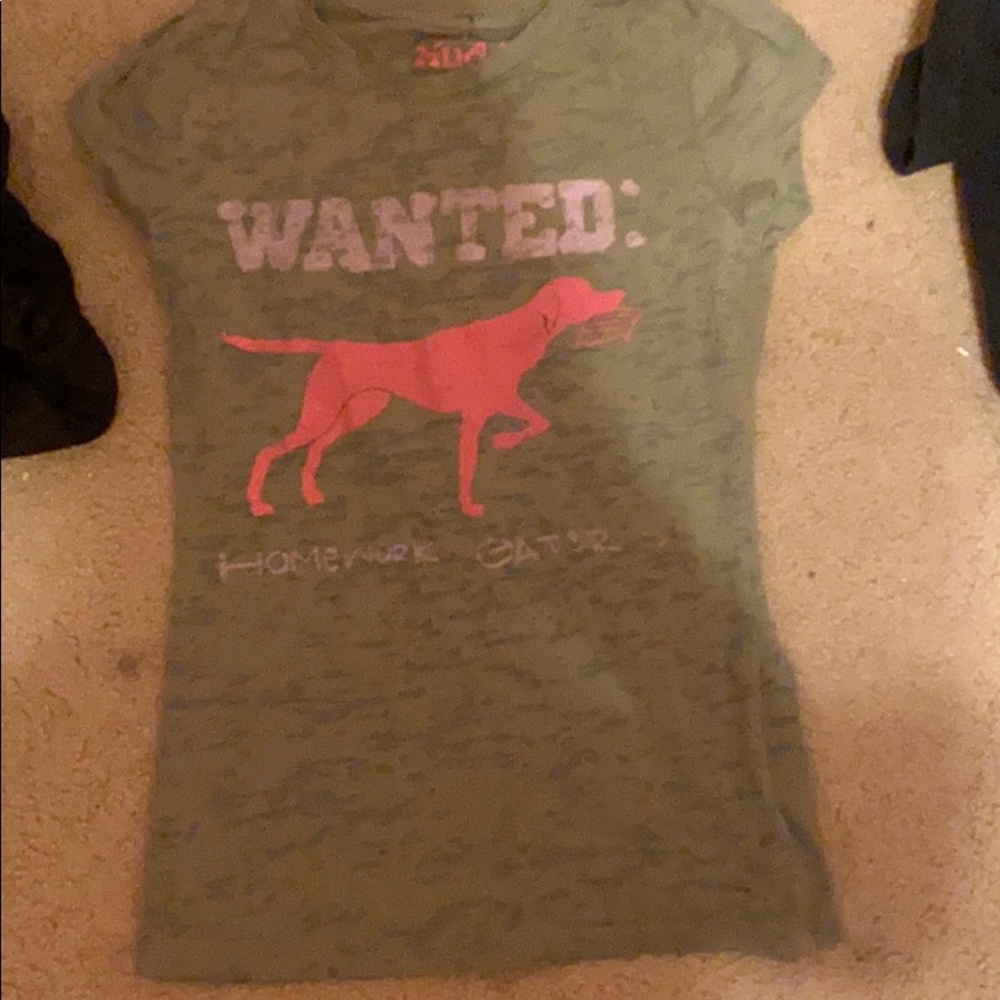 Shirt that a dog is eating a persons homework